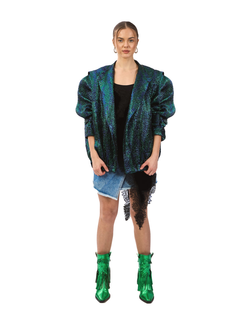 A bold iridescent jacket featuring a striking blend of deep emerald, teal