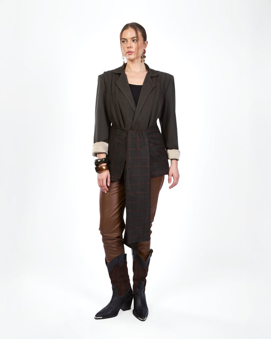 A  deep charcoal blazer reimagined with an asymmetric checkered panel